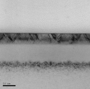 Bright field TEM image of implanted silicon with damaged top layer